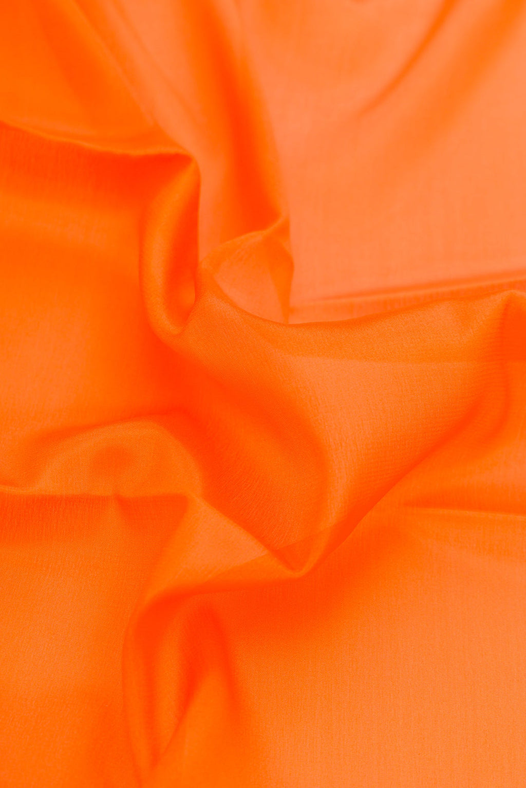Close up of Orange Dual Tone Mysore Silk Saree with Plain Body and Zari Border.  displaying folds