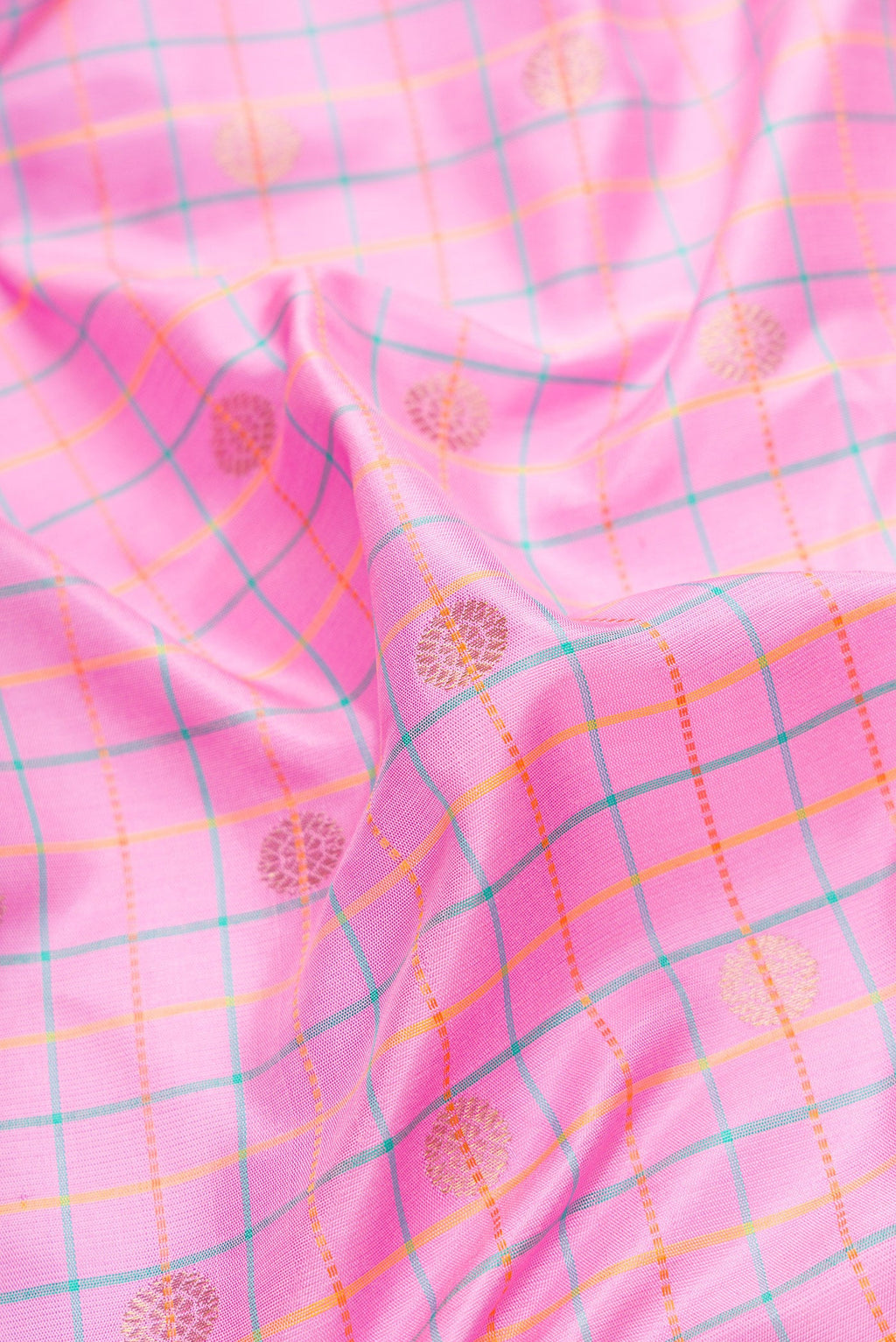 Close up of Pink Dual Tone Gadwal Silk Saree with Checked design on the body and Temple Border.  displaying folds