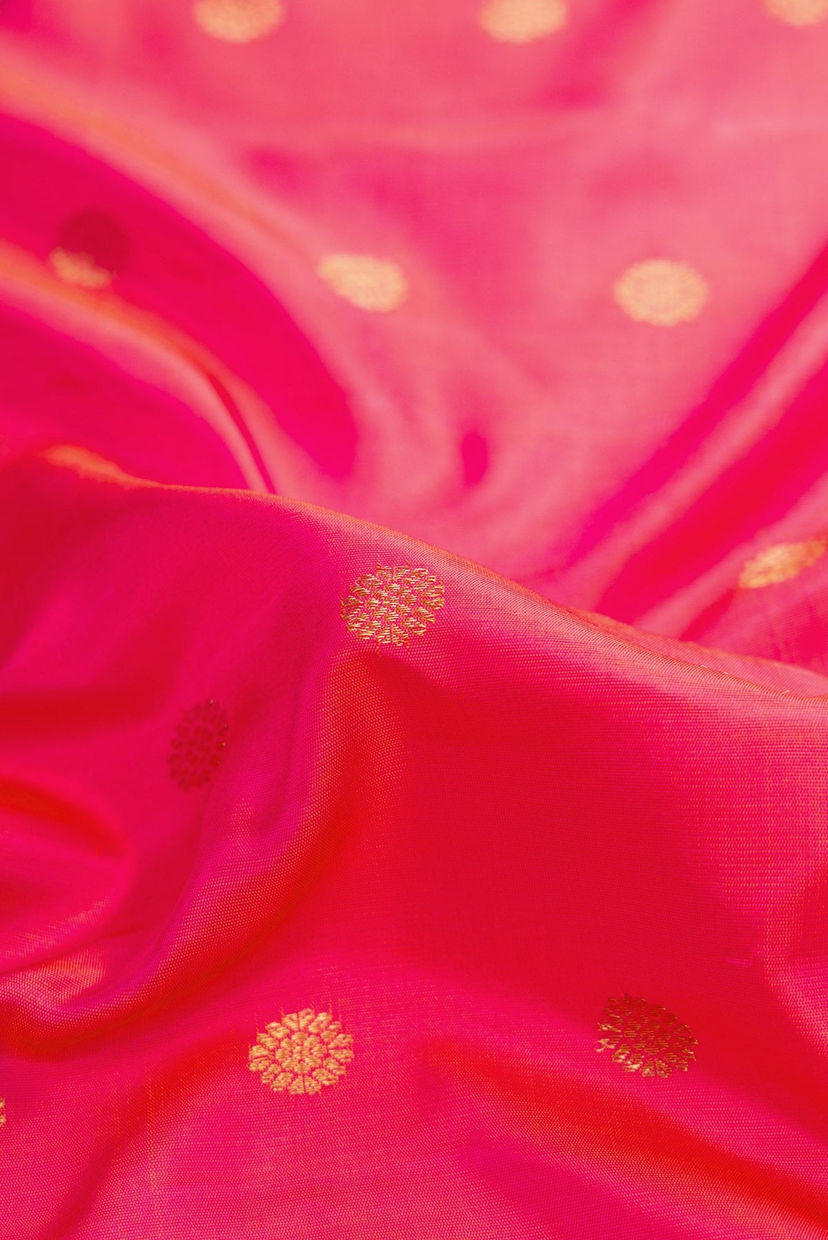 Close up of Pink Dual Tone Gadwal Silk Saree with Zari Butta on the body and Zari Border.  displaying folds