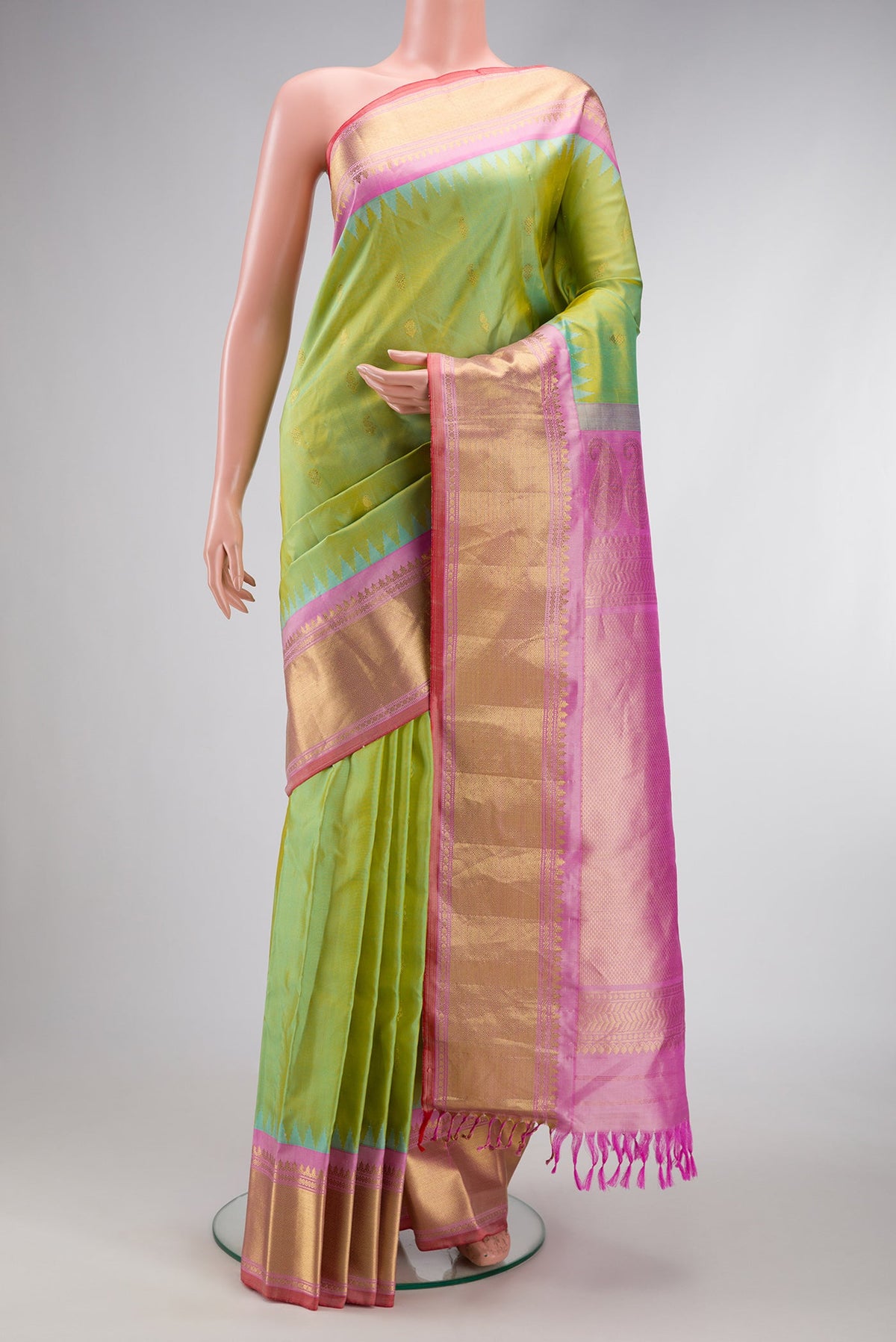Light Green Dual Tone Gadwal Silk Saree with Zari Butta on the body and Zari Border.  displayed on a mannequin