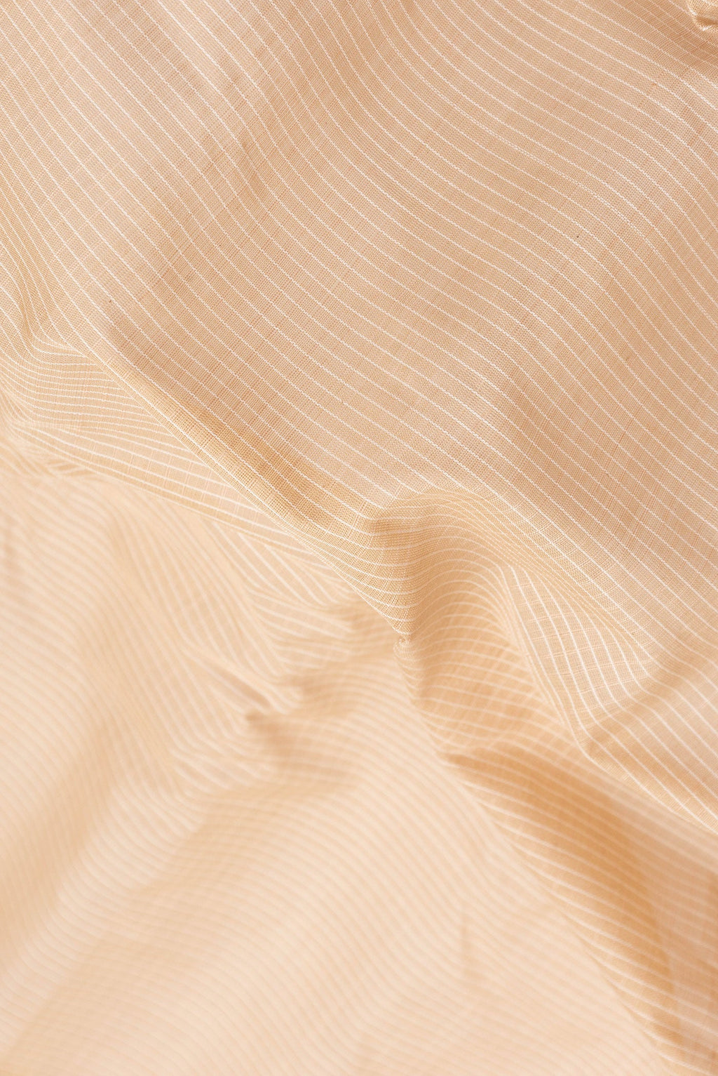 Close up of Beige Dual Tone Gadwal Silk Saree with Checked design on the body and Zari Border.  displaying folds