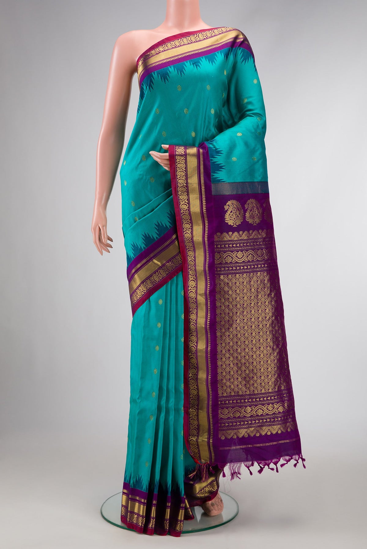 Maya Blue Dual Tone Gadwal Silk Saree with Zari Butta on the body and Zari Border.  displayed on a mannequin