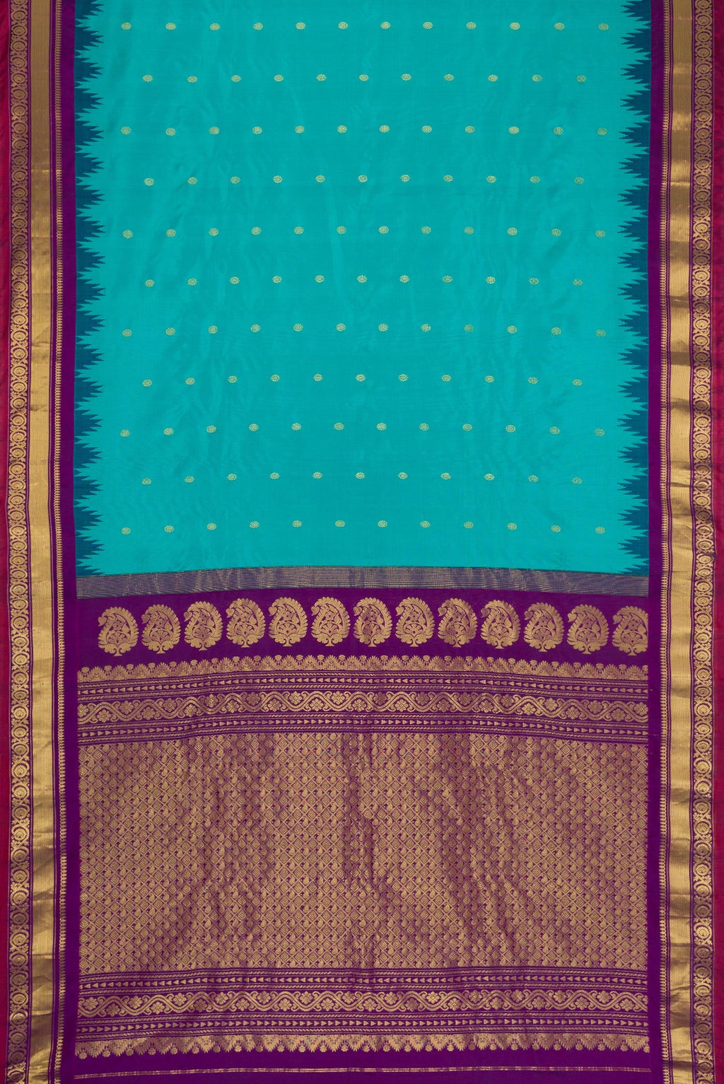 Flat view of Maya Blue Dual Tone Gadwal Silk Saree with Zari Butta on the body and Zari Border. 