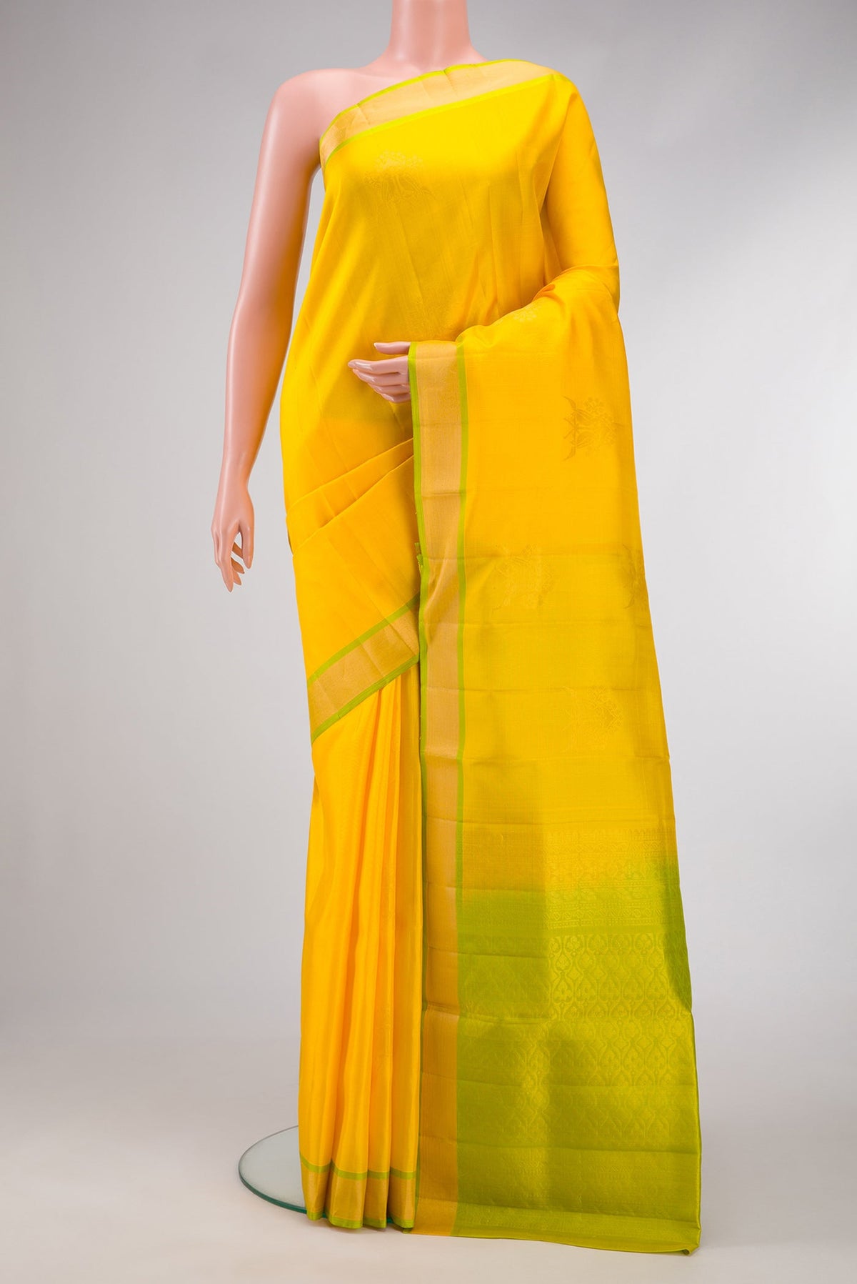 Yellow Dual Tone Soft Silk Saree with Zari Butta on the body and Zari Border.  displayed on a mannequin