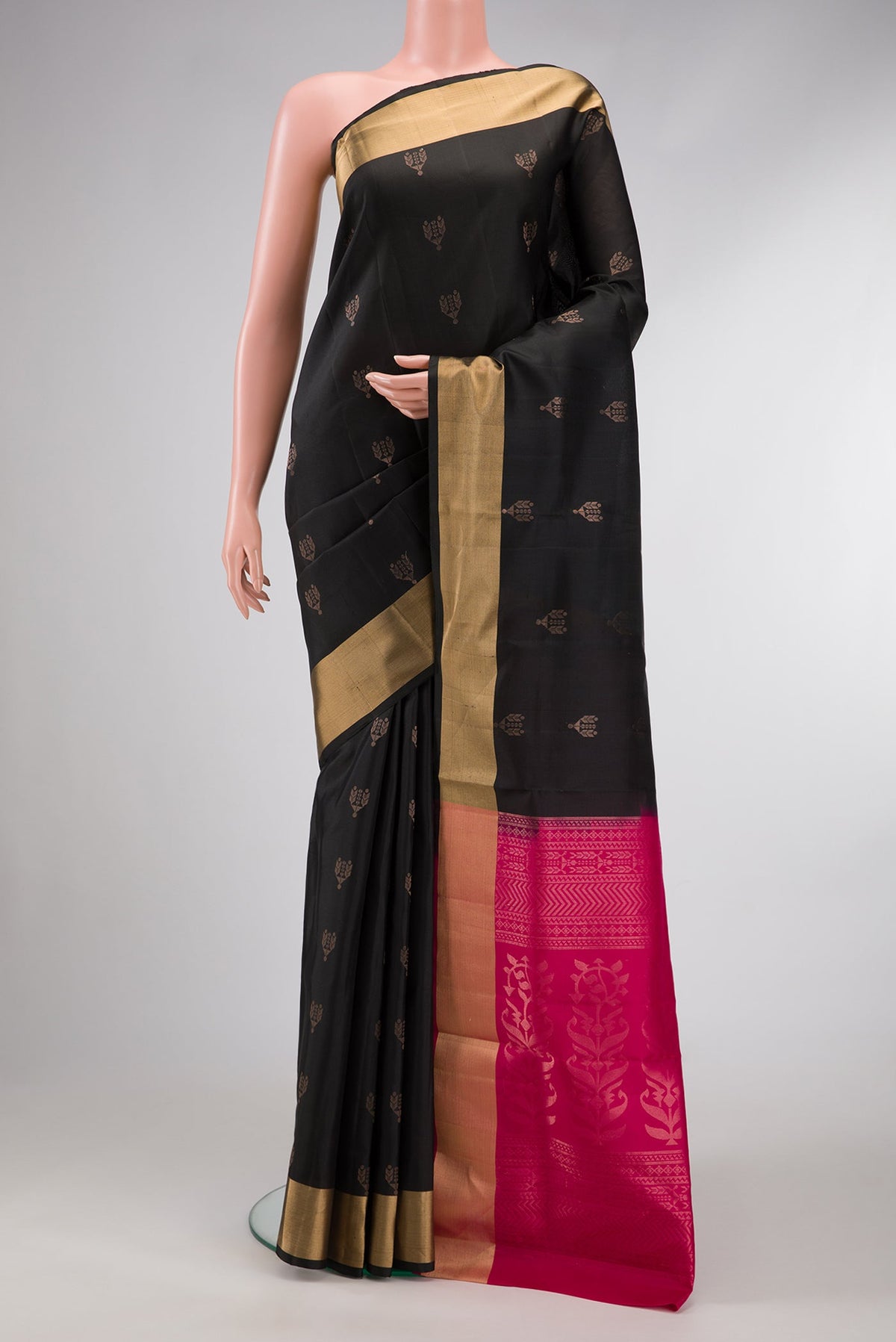 Black Dual Tone Soft Silk Saree with Zari Butta on the body and Zari Border.  displayed on a mannequin