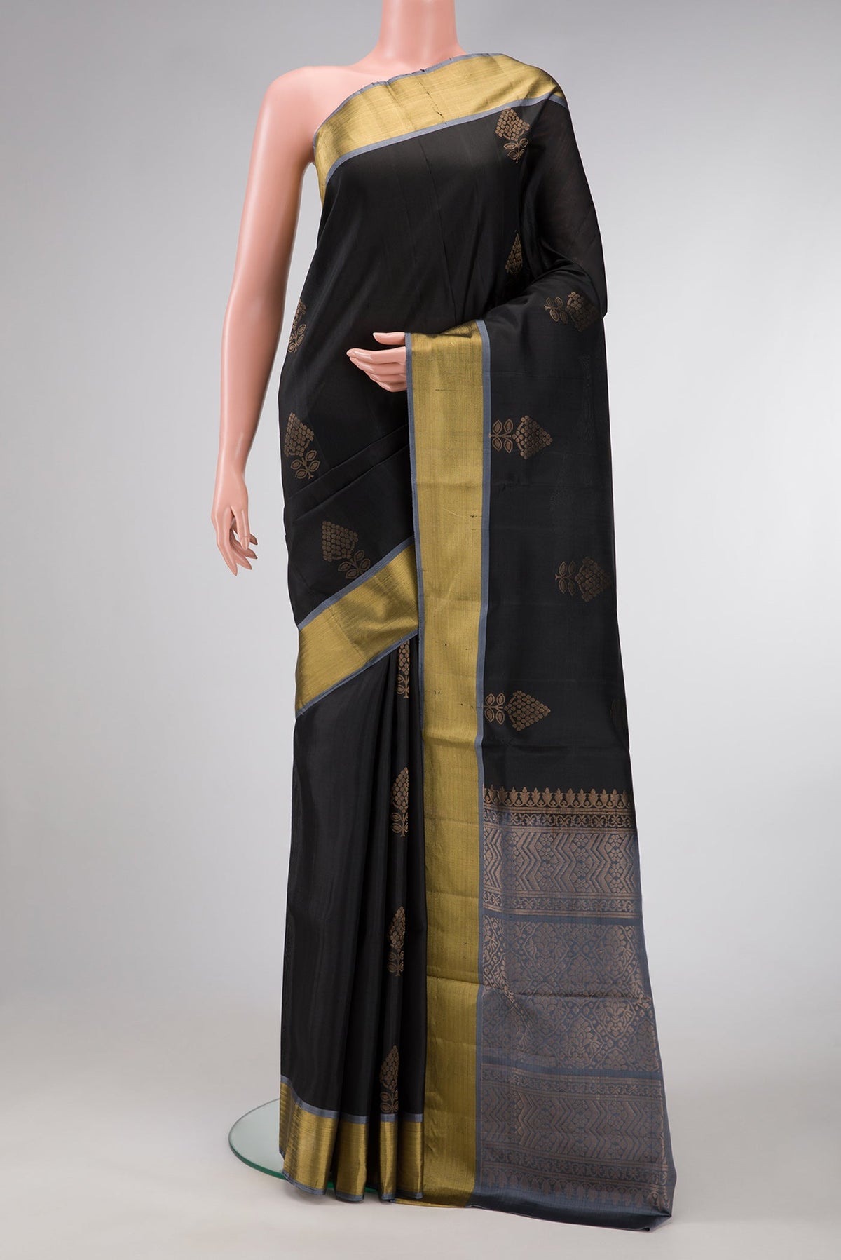 Black Dual Tone Soft Silk Saree with Zari Butta on the body and Zari Border.  displayed on a mannequin