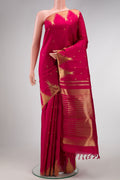 Maroon Dual Tone Kanchipuram Silk Saree with Zari Butta on the body and Temple Border.  displayed on a mannequin