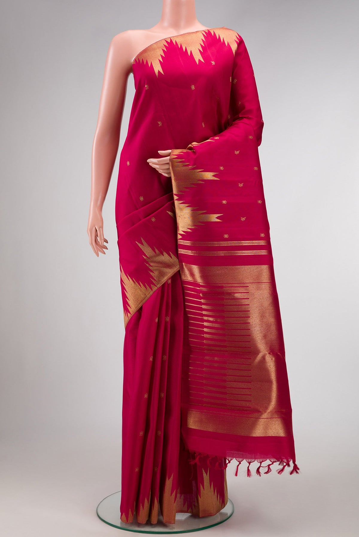 Maroon Dual Tone Kanchipuram Silk Saree with Zari Butta on the body and Temple Border.  displayed on a mannequin