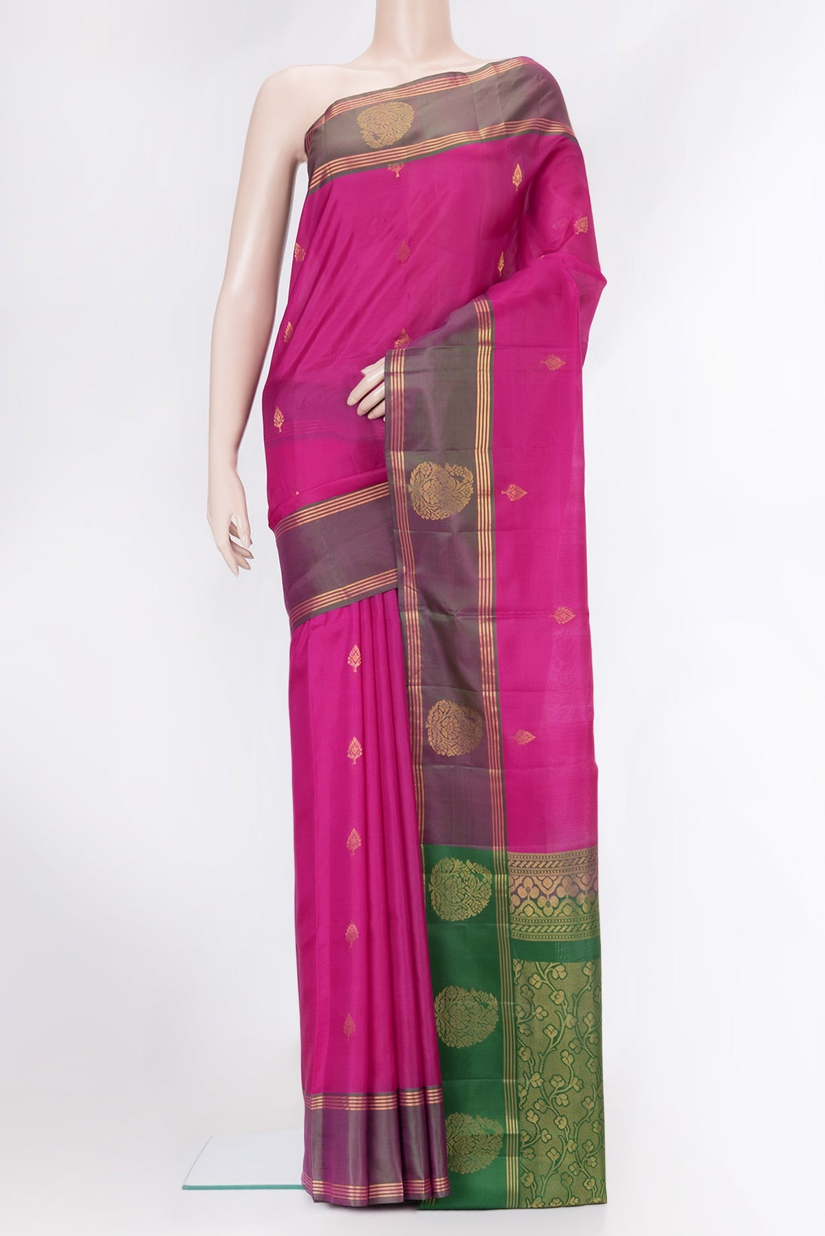 Magenta Soft Silk Saree with Zari Butta on the body and Fancy Border.  displayed on a mannequin