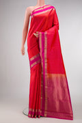 Orange Dual Tone Kanchipuram Silk Saree with Zari Butta on the body and Zari Border.  displayed on a mannequin