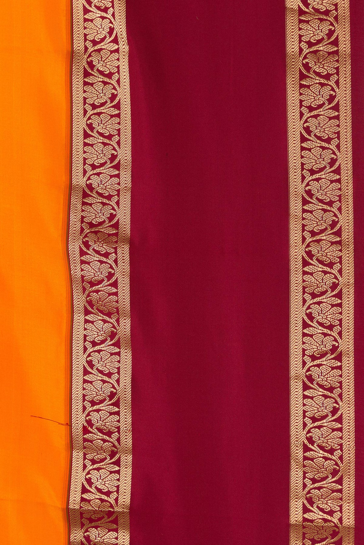 Border image of Orange Dual Tone Kanchipuram Silk Saree with Plain Body and Zari Border. 