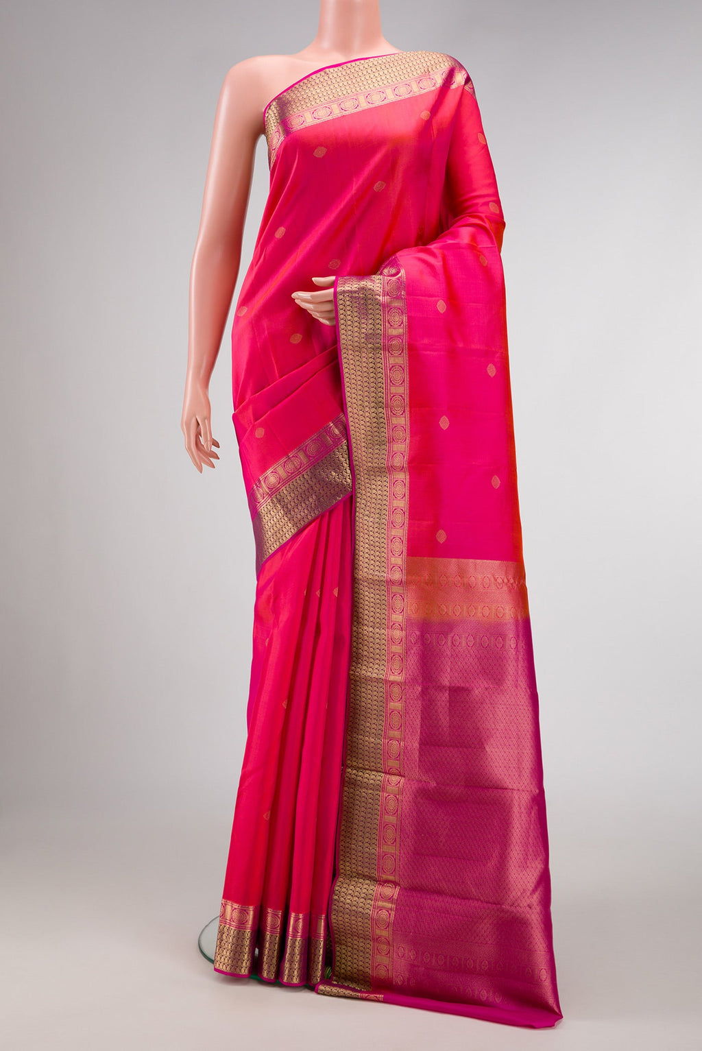 Pink Dual Tone Kanchipuram Silk Saree with Zari Butta on the body and Zari Border.  displayed on a mannequin