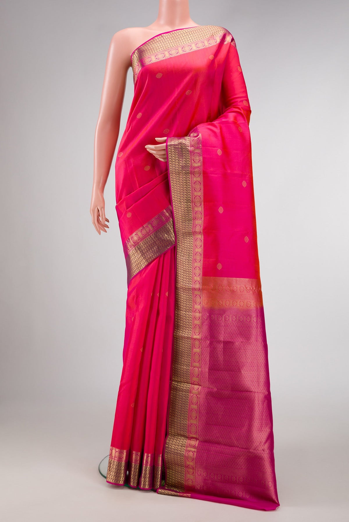 Pink Dual Tone Kanchipuram Silk Saree with Zari Butta on the body and Zari Border.  displayed on a mannequin