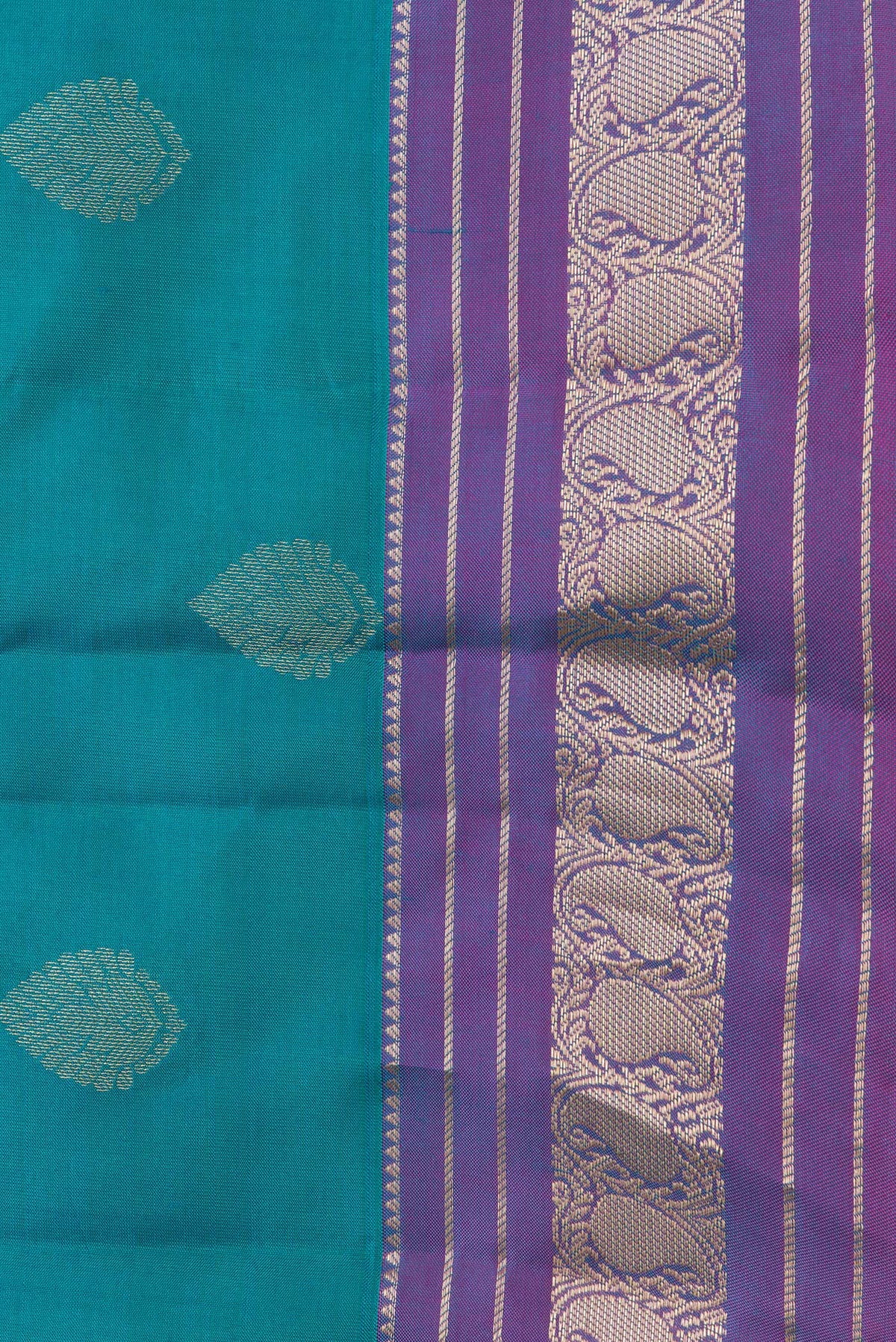 Border image of Peacock Blue Dual Tone Kanchipuram Silk Saree with Zari Butta on the body and Zari Border. 