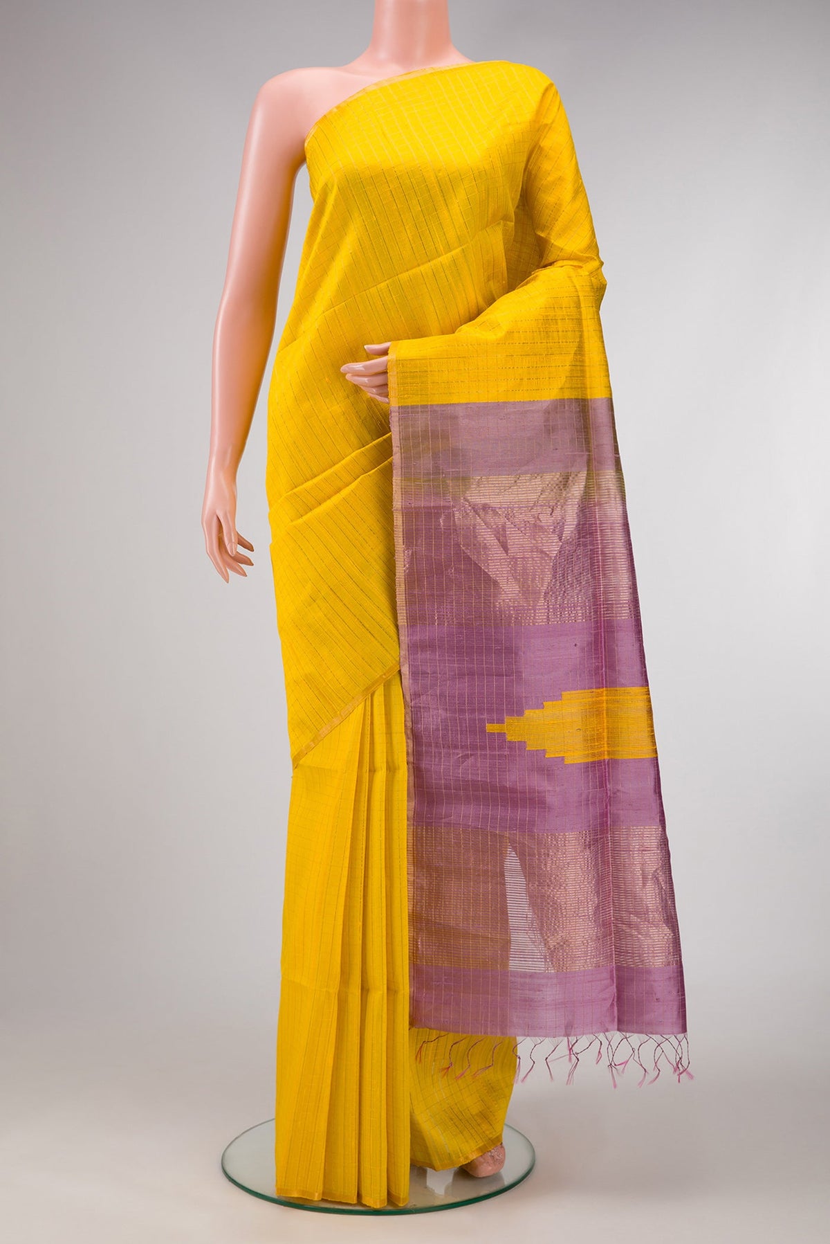 Yellow Dual Tone Raw Silk Saree with Checked design on the body and Thin Zari Line.  displayed on a mannequin