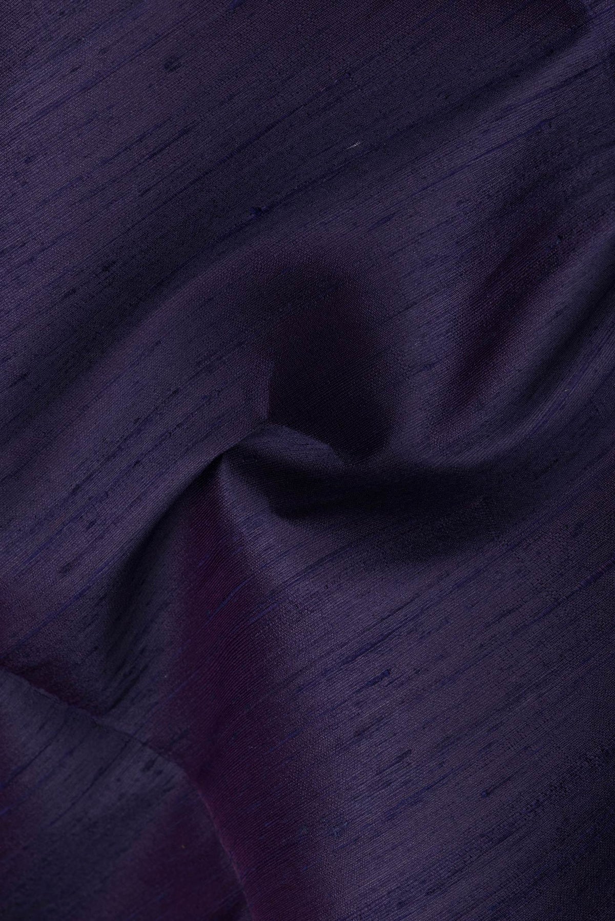 Close up of Navy Blue Dual Tone Raw Silk Saree with Plain Body and Plain Border.  displaying folds