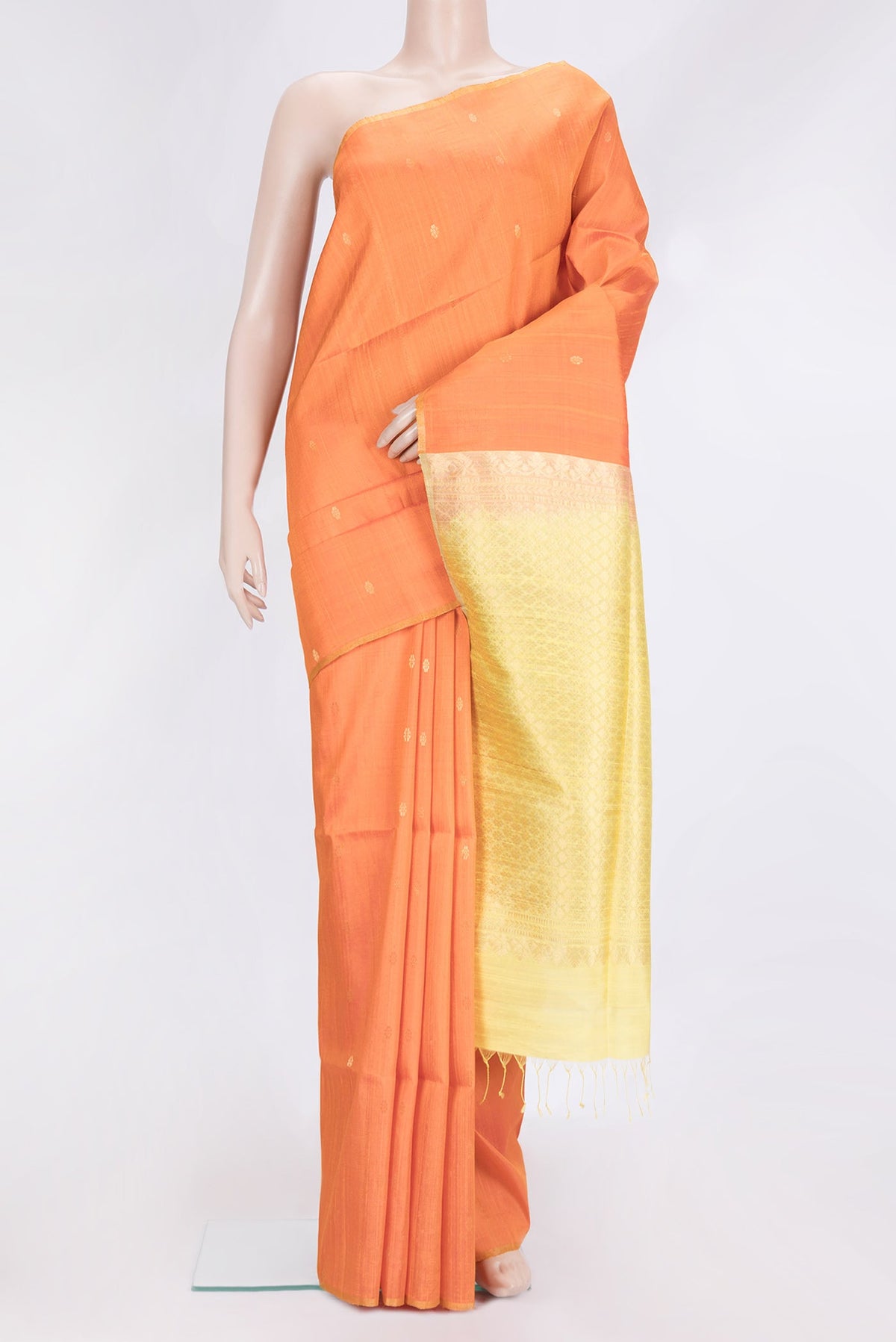 Orange Dual Tone Raw Silk Saree with Zari Butta on the body and Zari Border.  displayed on a mannequin