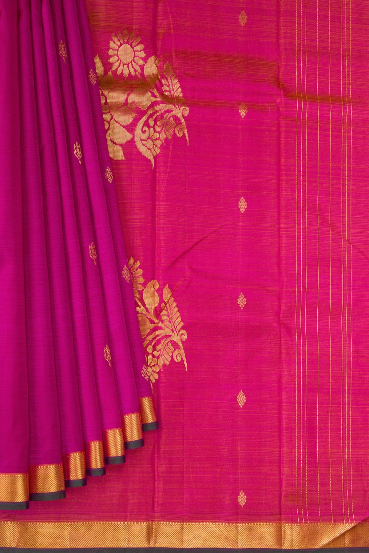 Pleats and pallu of Magenta Kanchipuram Silk Saree with Zari Butta on the body and Zari Border. 