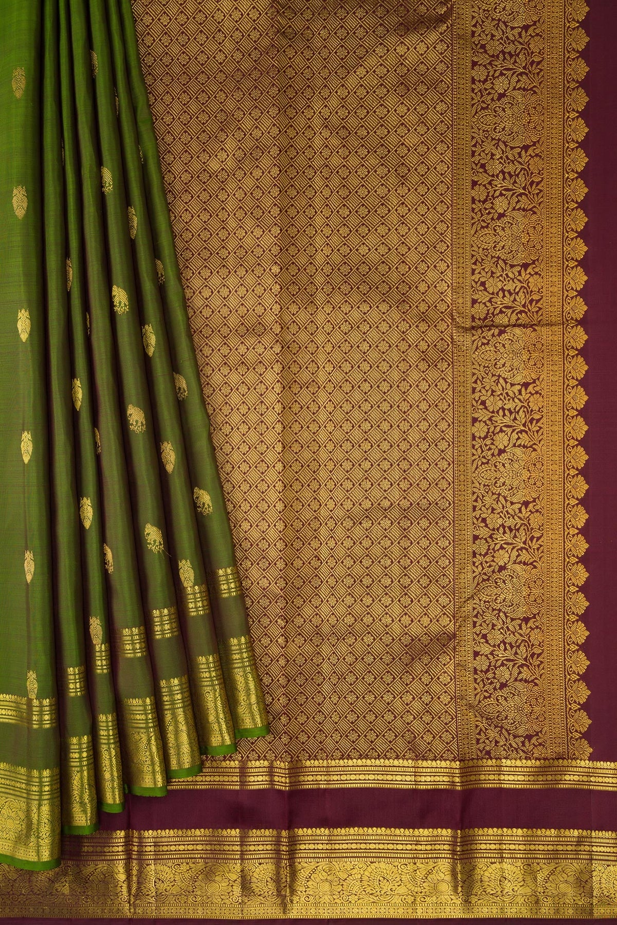 Pleats and pallu of Mehandi Green Dual Tone Kanjivaram Silk Saree with Zari Butta on the body and Zari Border. 