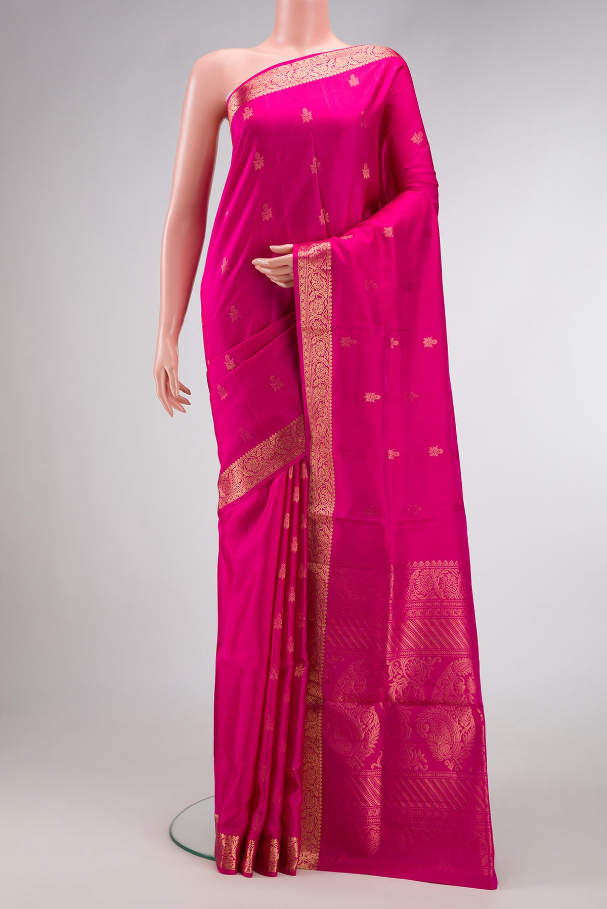 Pink Soft Silk Saree with Zari Butta on the body and Zari Border.  displayed on a mannequin