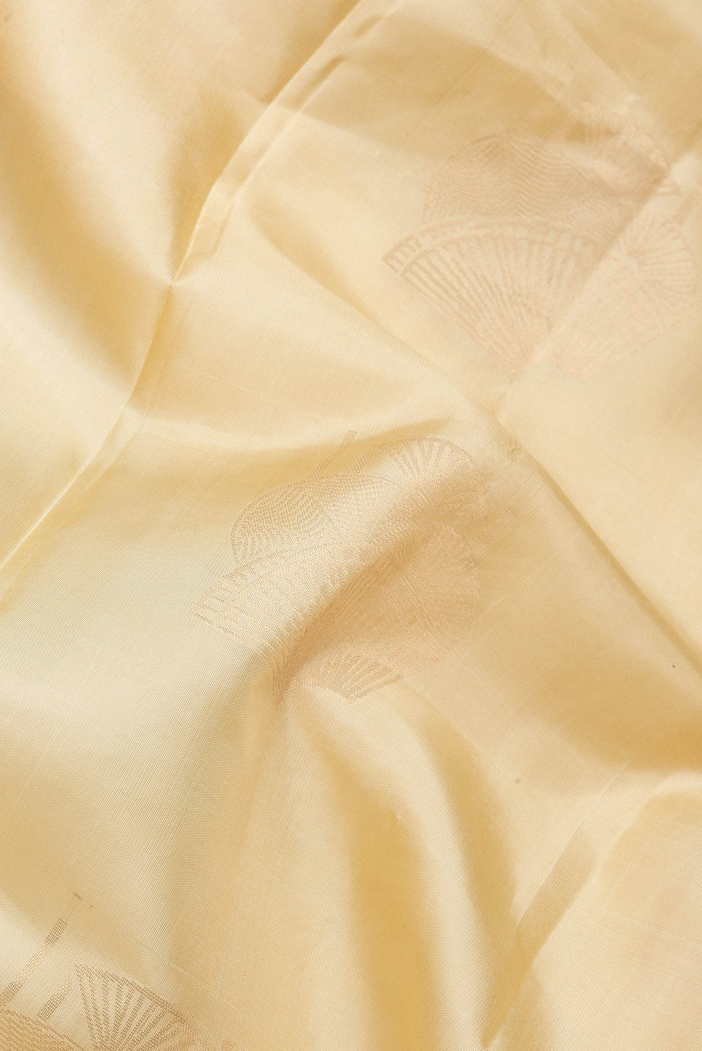 Close up of Sandal Dual Tone Soft Silk Saree with Zari Butta on the body and Without Border.  displaying folds