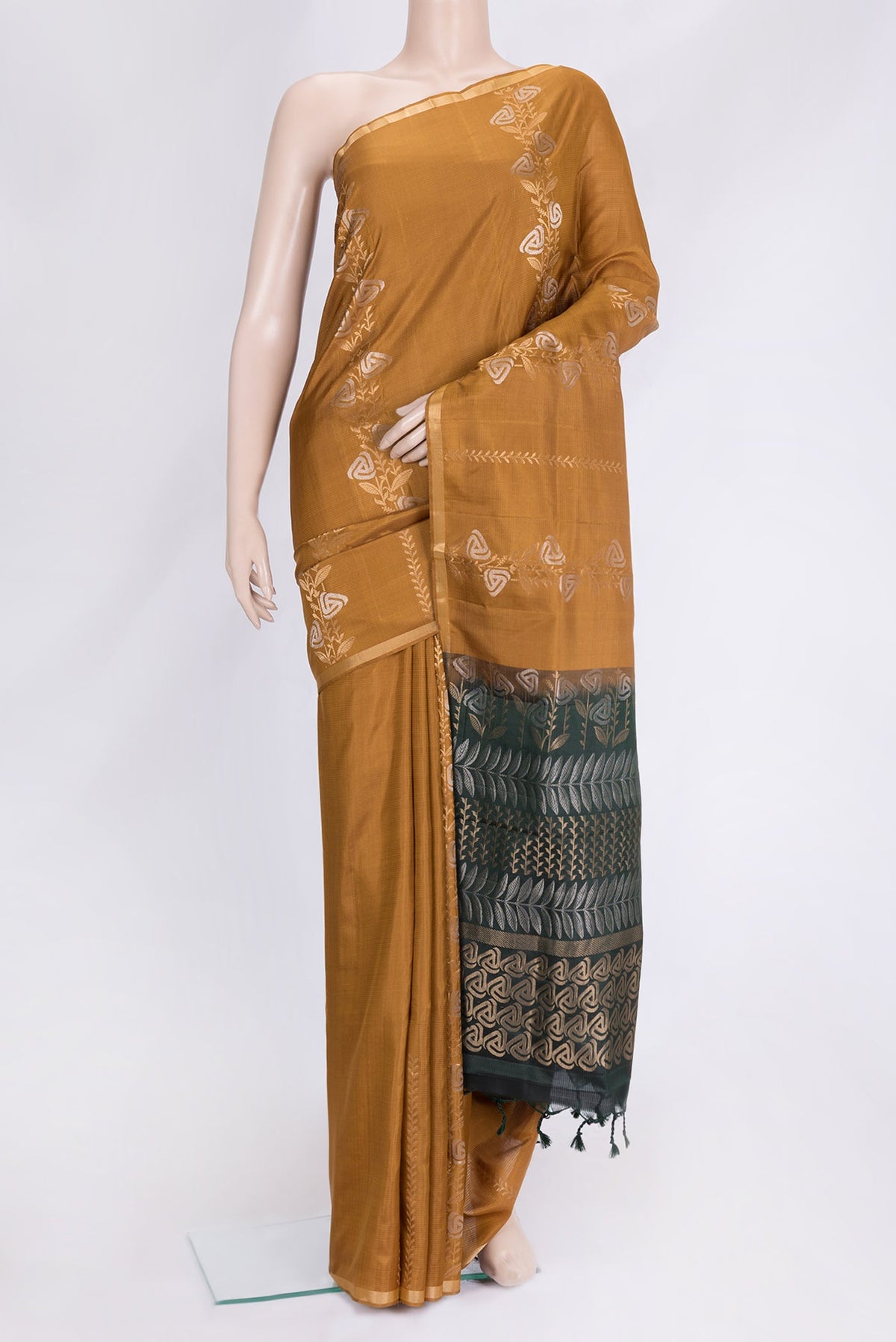 Mustard Dual Tone Soft Silk Saree with Zari Butta on the body and Zari Border.  displayed on a mannequin