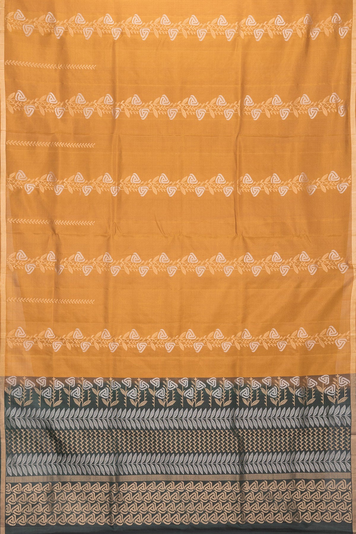 Flat view of Mustard Dual Tone Soft Silk Saree with Zari Butta on the body and Zari Border. 