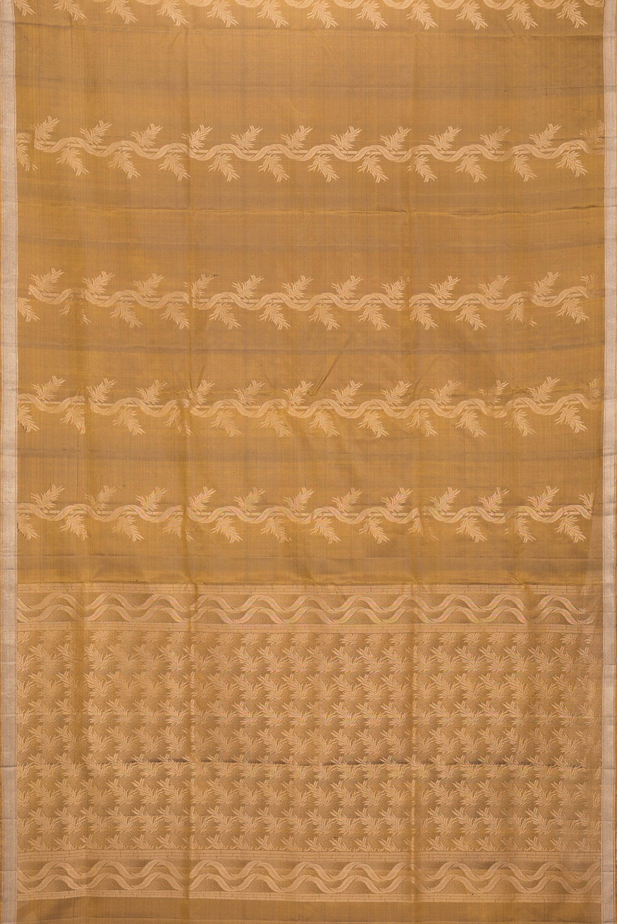 Flat view of Gold Dual Tone Soft Silk Saree with Zari Butta on the body and Zari Border. 