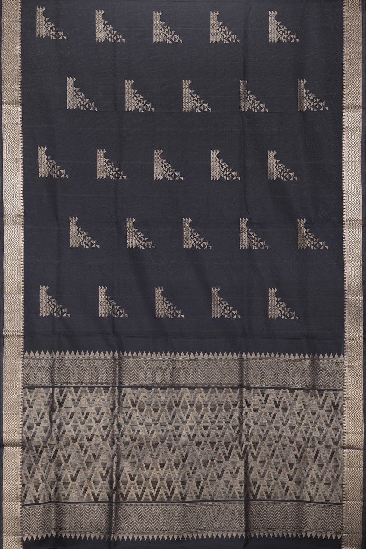 Flat view of Black Dual Tone Soft Silk Saree with Zari Butta on the body and Zari Border. 