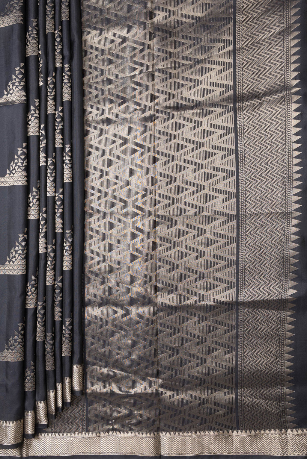 Pleats and pallu of Black Dual Tone Soft Silk Saree with Zari Butta on the body and Zari Border. 