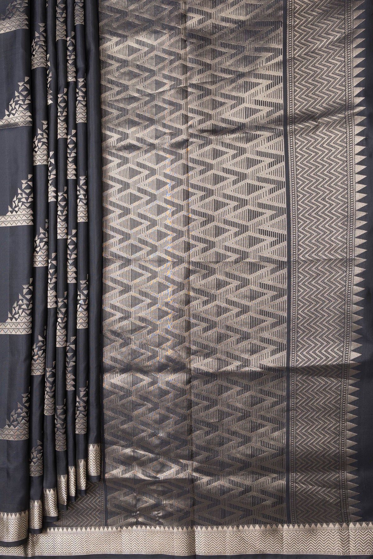 Pleats and pallu of Black Dual Tone Soft Silk Saree with Zari Butta on the body and Zari Border. 