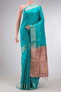 Maya Blue Dual Tone Soft Silk Saree with Zari Butta on the body and Zari Border.  displayed on a mannequin