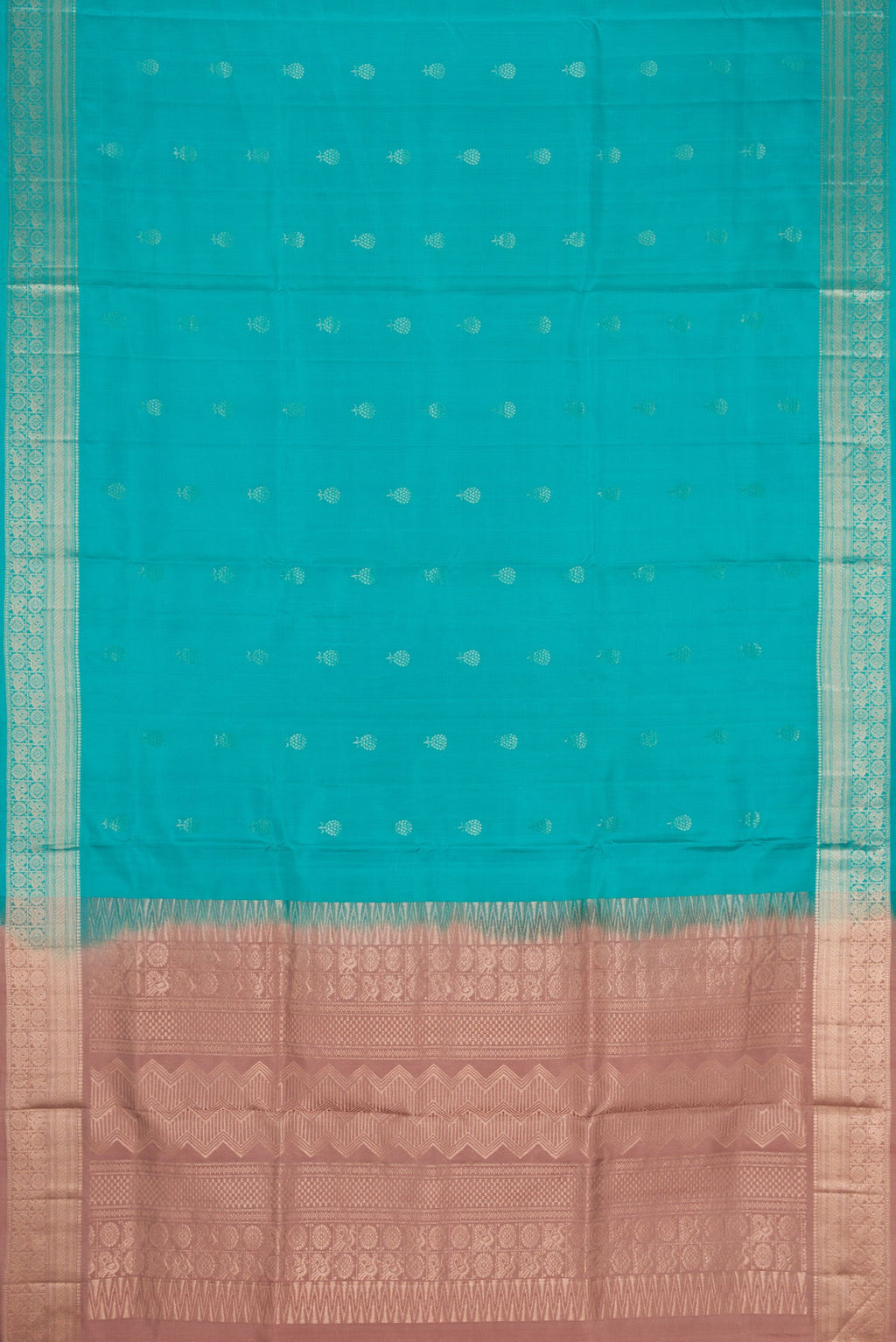 Flat view of Maya Blue Dual Tone Soft Silk Saree with Zari Butta on the body and Zari Border. 