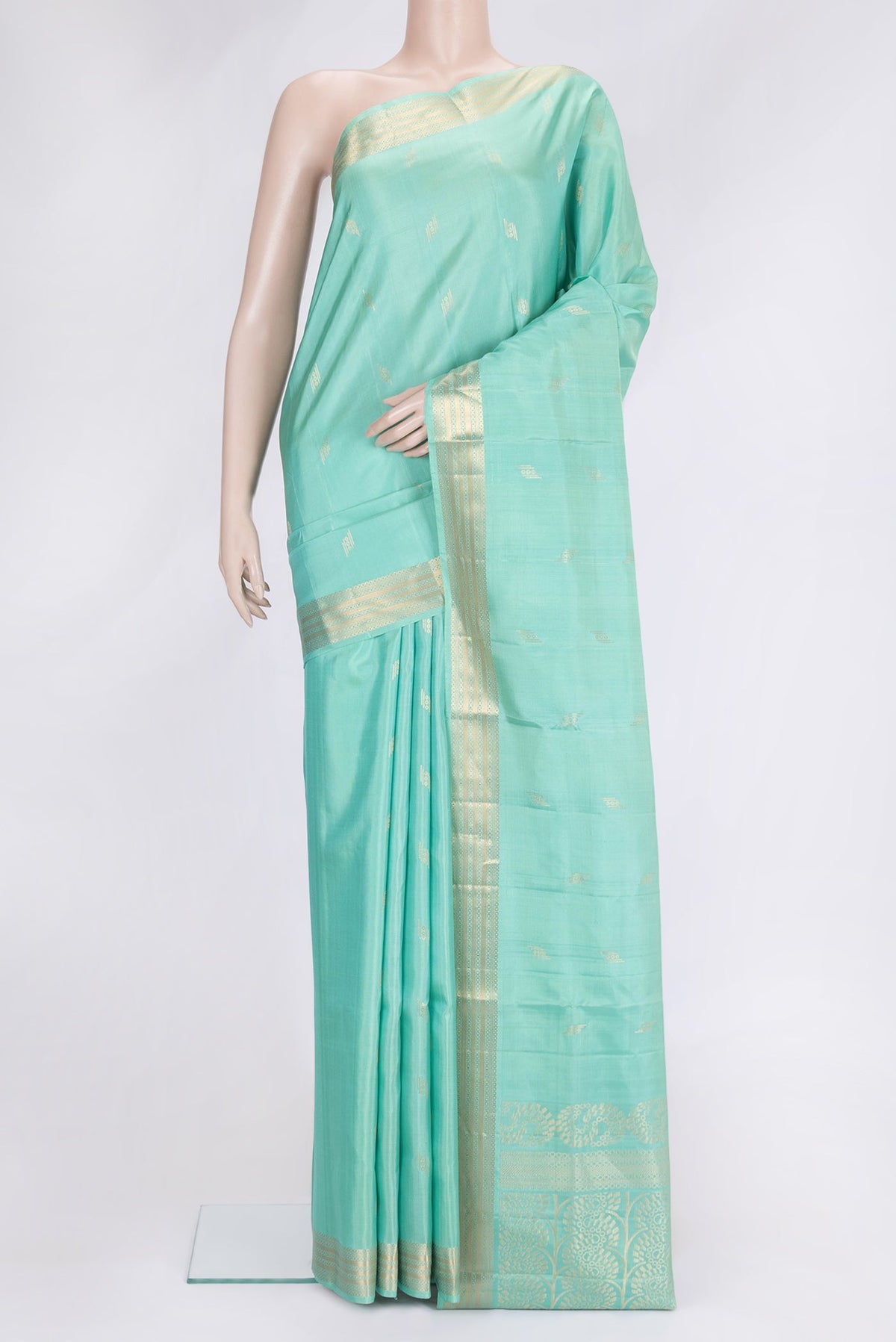 Sea Green Dual Tone Soft Silk Saree with Zari Butta on the body and Zari Border.  displayed on a mannequin