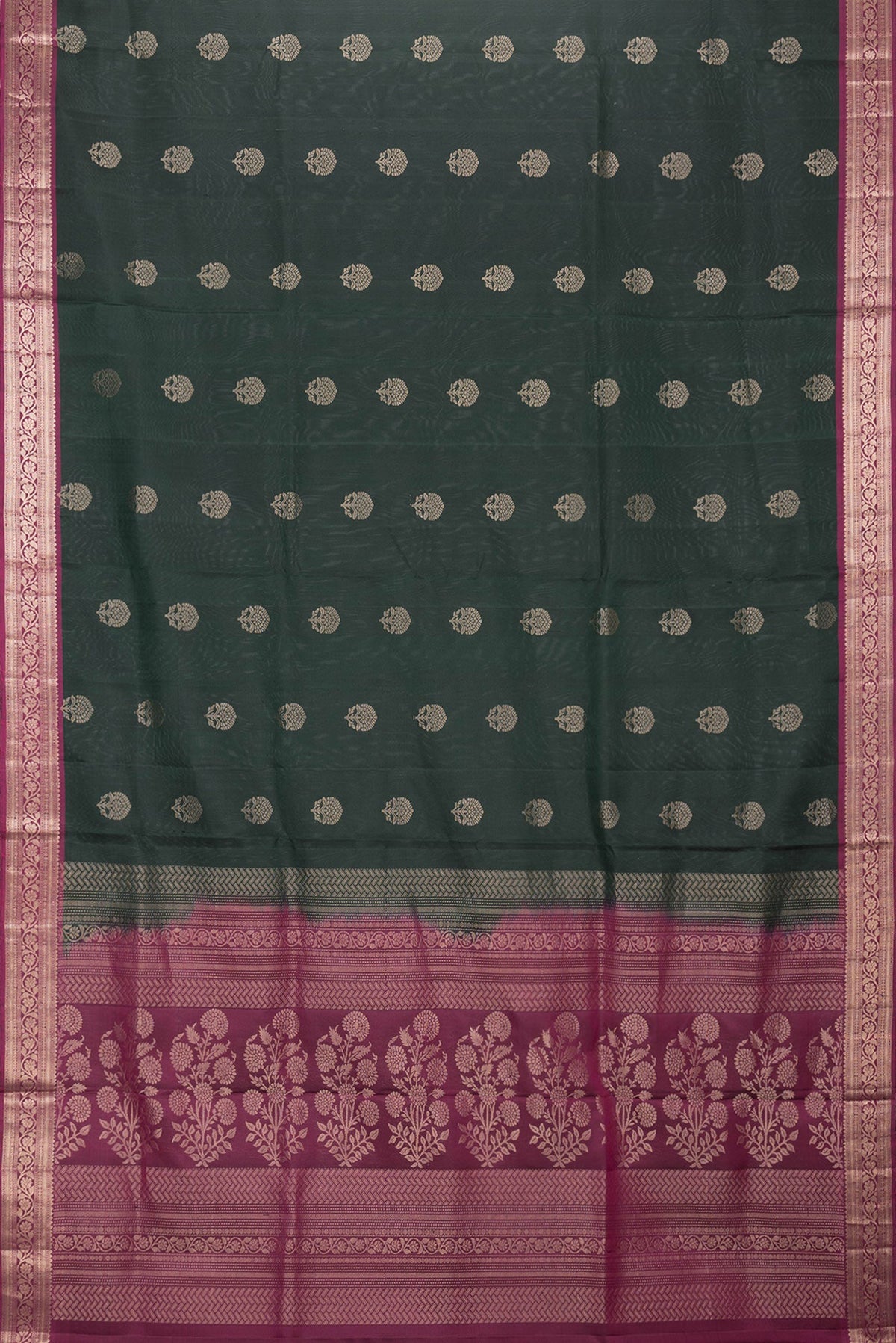 Flat view of Bottle Green Dual Tone Soft Silk Saree with Zari Butta on the body and Zari Border. 
