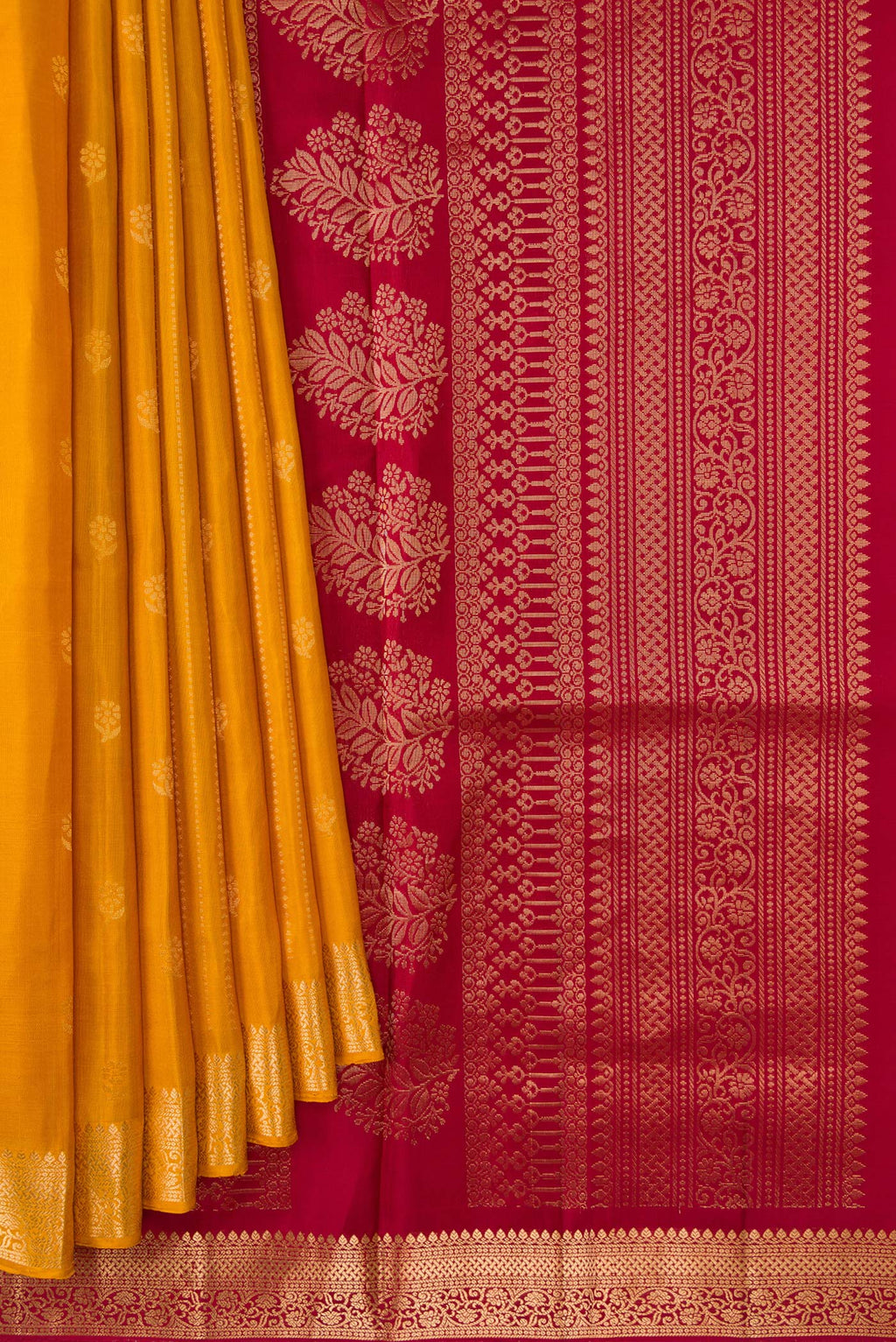 Pleats and pallu of Yellow Soft Silk Saree with Stripes on the body and Zari Border. 