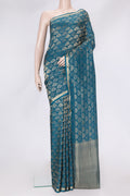 Peacock Blue Dual Tone Tussar Silk Saree with Zari Brocade on the body and Zari Border.  displayed on a mannequin