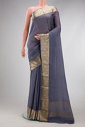 Grey Georgette Saree with Plain Body and Zari Border.  displayed on a mannequin