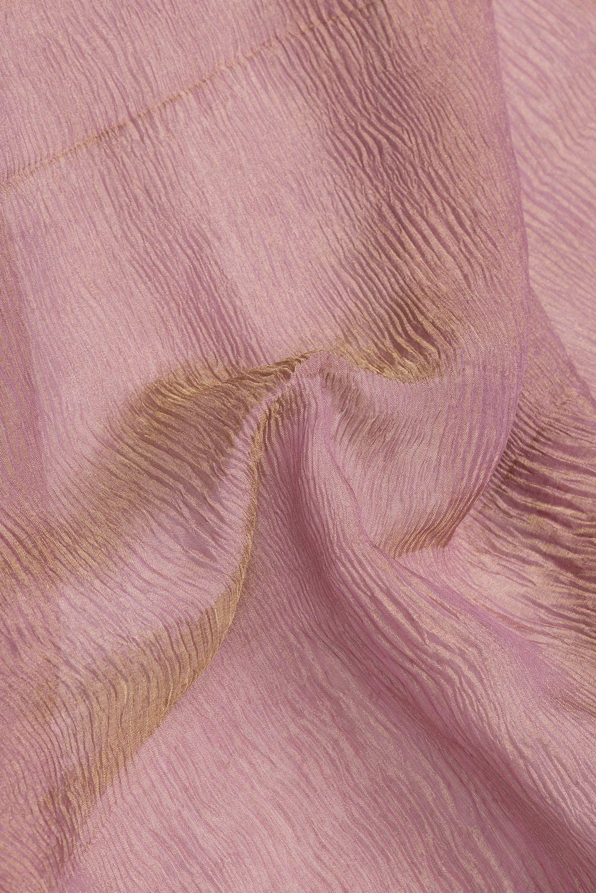 Close up of Rose Gold Dual Tone Mysore Georgette Saree with Plain Body and Zari Border.  displaying folds