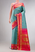 Pure Silk Pure Zari Sky Blue Dual Tone Kanjivaram Saree with Zari Butta on the body and Zari Border.  displayed on a mannequin
