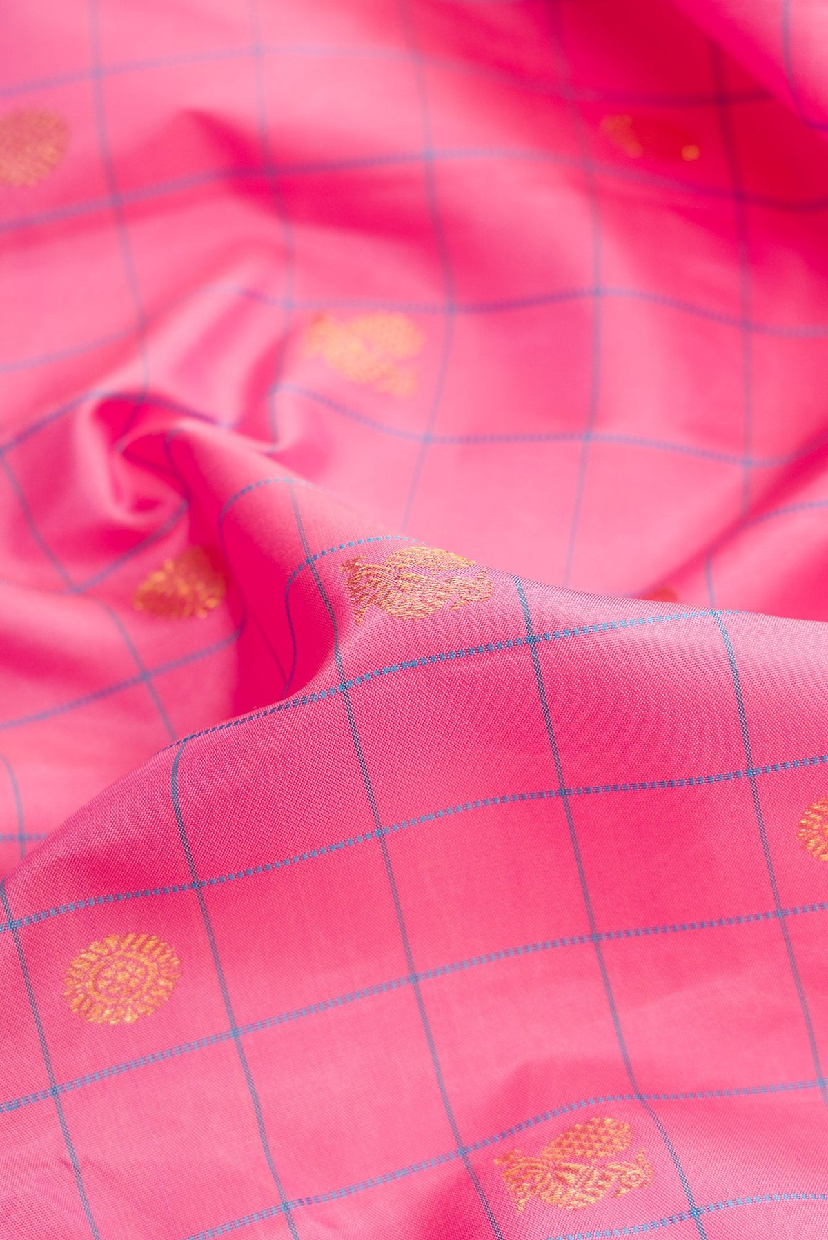 Close up of Pure Silk Pure Zari Pink Dual Tone Kanjivaram Saree with Checked design on the body and Zari Border.  displaying folds