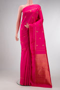 Pure Silk Pure Zari Pink Kanjivaram Saree with Zari And Thread Butta on the body and Plain Border.  displayed on a mannequin