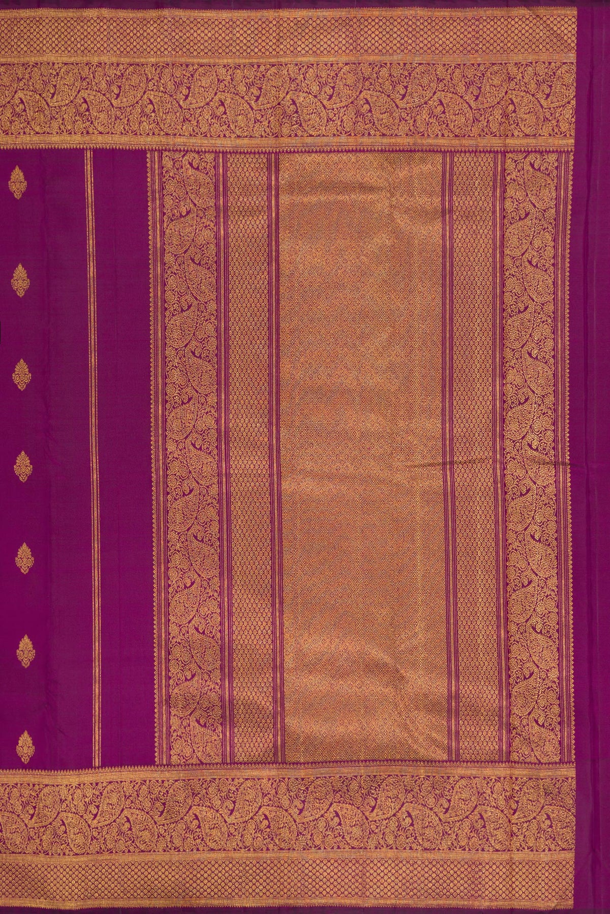 Close up image of the pallu of Purple Dual Tone Kanjivaram Silk Saree with Zari Butta on the body and Zari Border. 