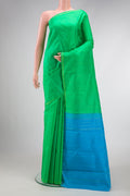 Parrot Green Dual Tone Kanjivaram Silk Saree with Zari Butta on the body and Zari Border.  displayed on a mannequin
