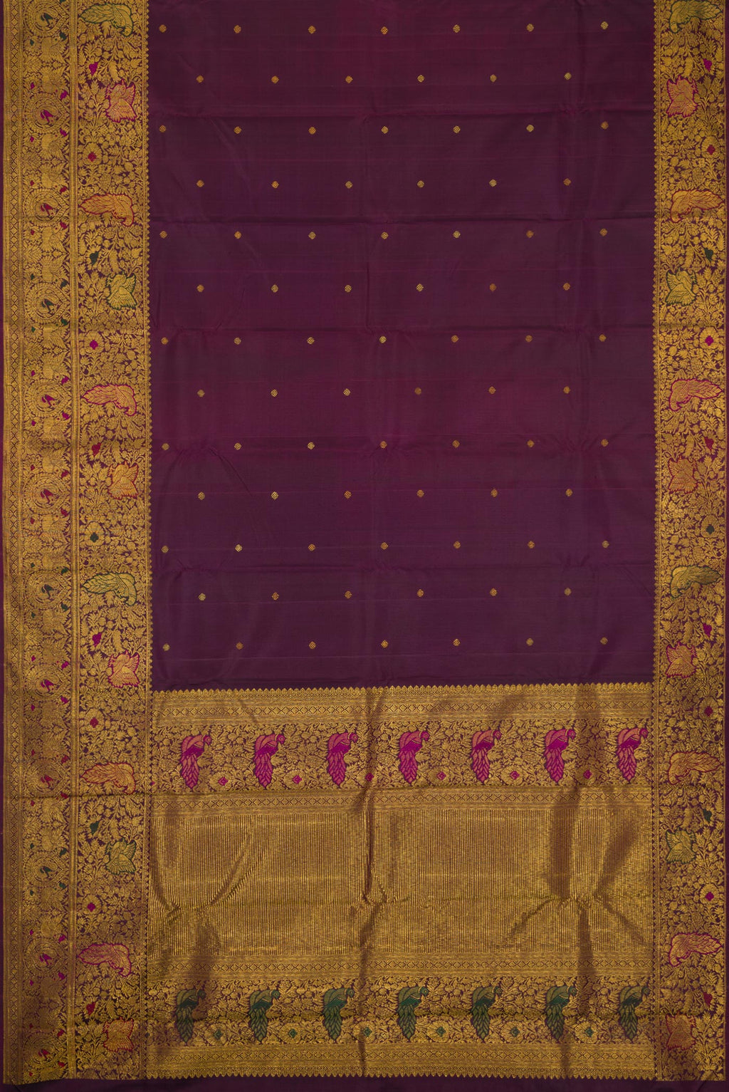 Flat view of Purple Kanchipuram Silk Saree with Zari Butta on the body and Fancy Border. 