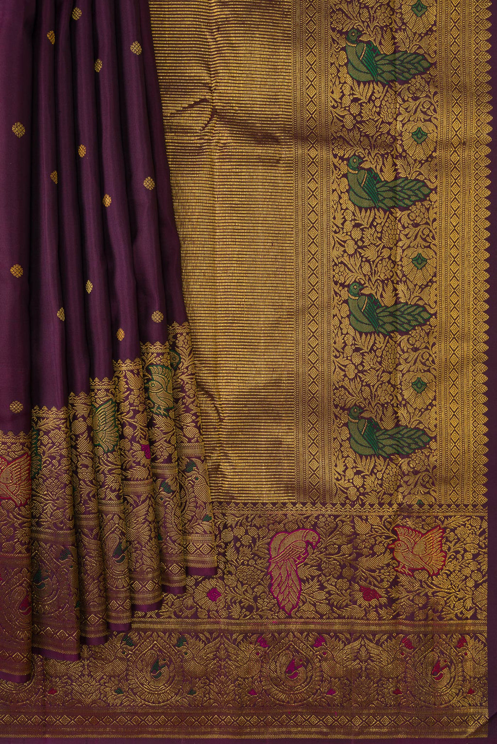 Pleats and pallu of Purple Kanchipuram Silk Saree with Zari Butta on the body and Fancy Border. 
