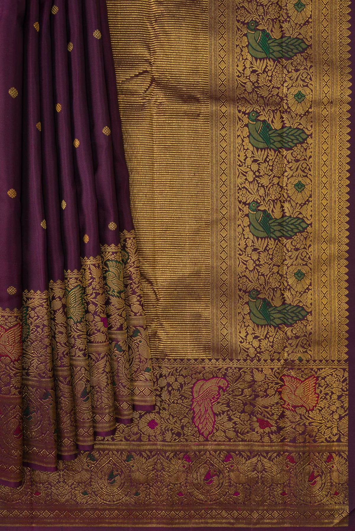 Pleats and pallu of Purple Kanchipuram Silk Saree with Zari Butta on the body and Fancy Border. 