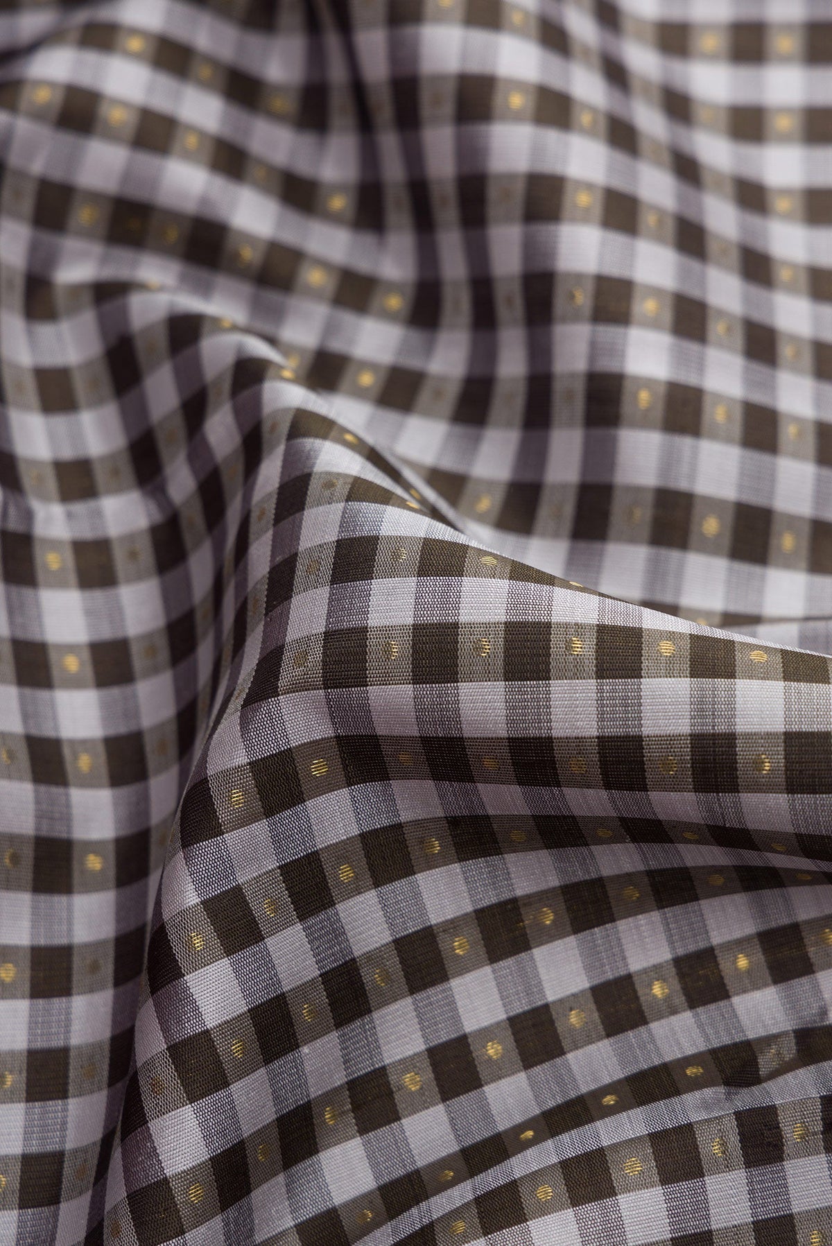Close up of Pure Silk Pure Zari Grey Dual Tone Kanjivaram Saree with Checked design on the body and Zari Border.  displaying folds