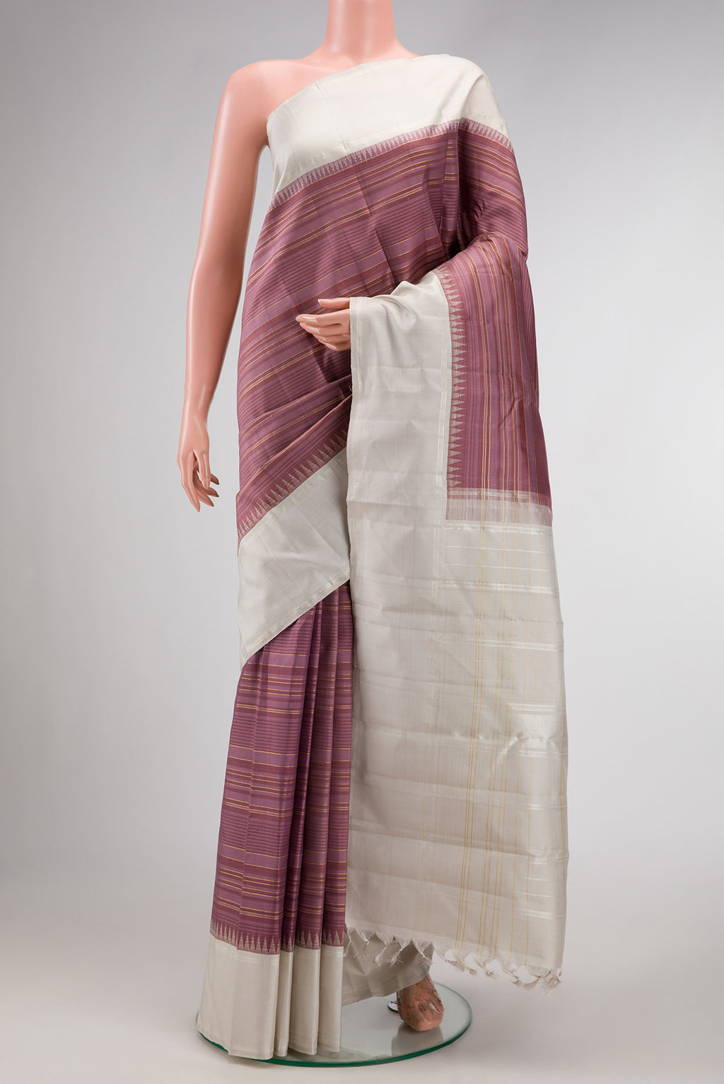 Mauve Kanjivaram Silk Saree with Stripes on the body and Plain Border.  displayed on a mannequin