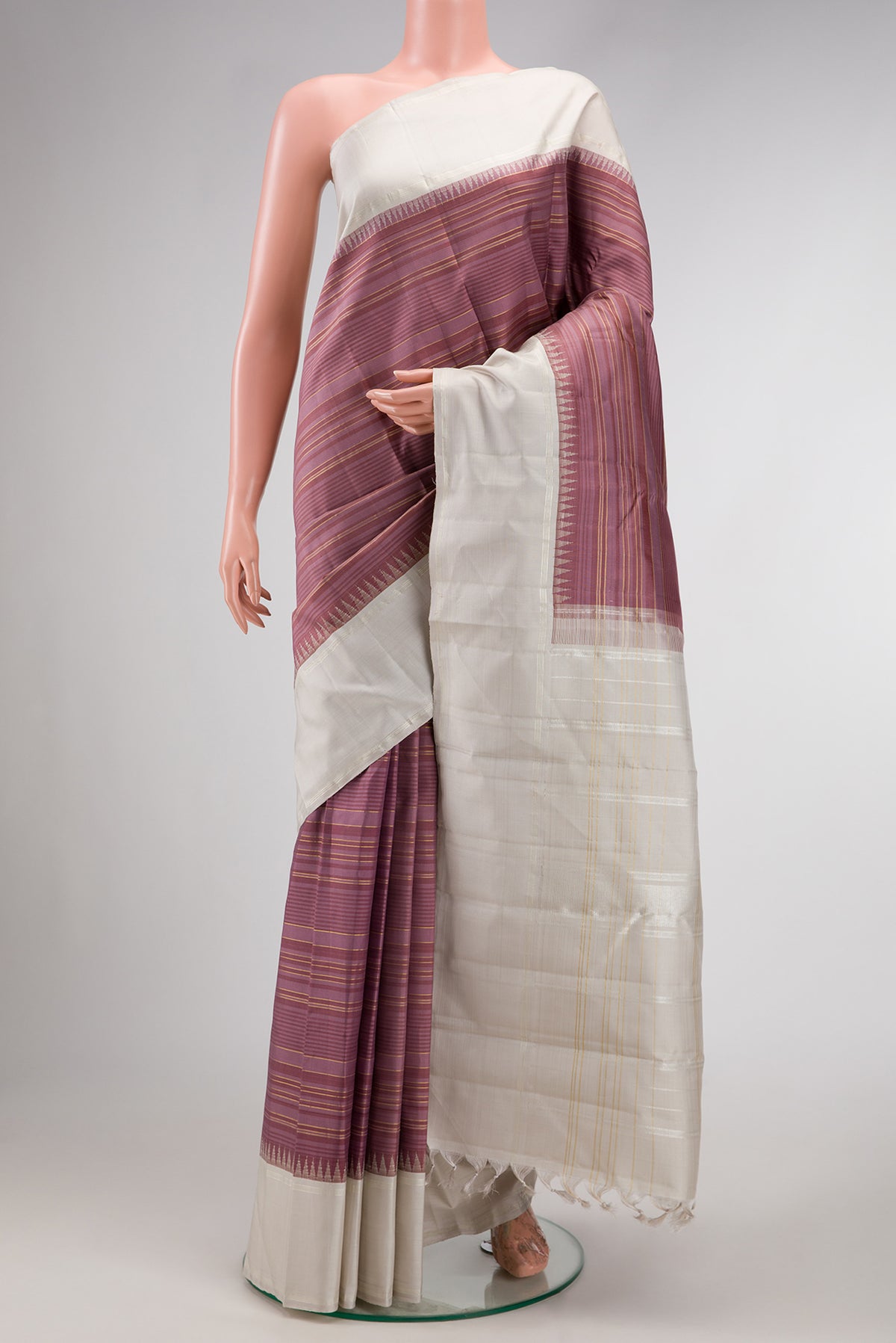 Mauve Kanjivaram Silk Saree with Stripes on the body and Plain Border.  displayed on a mannequin